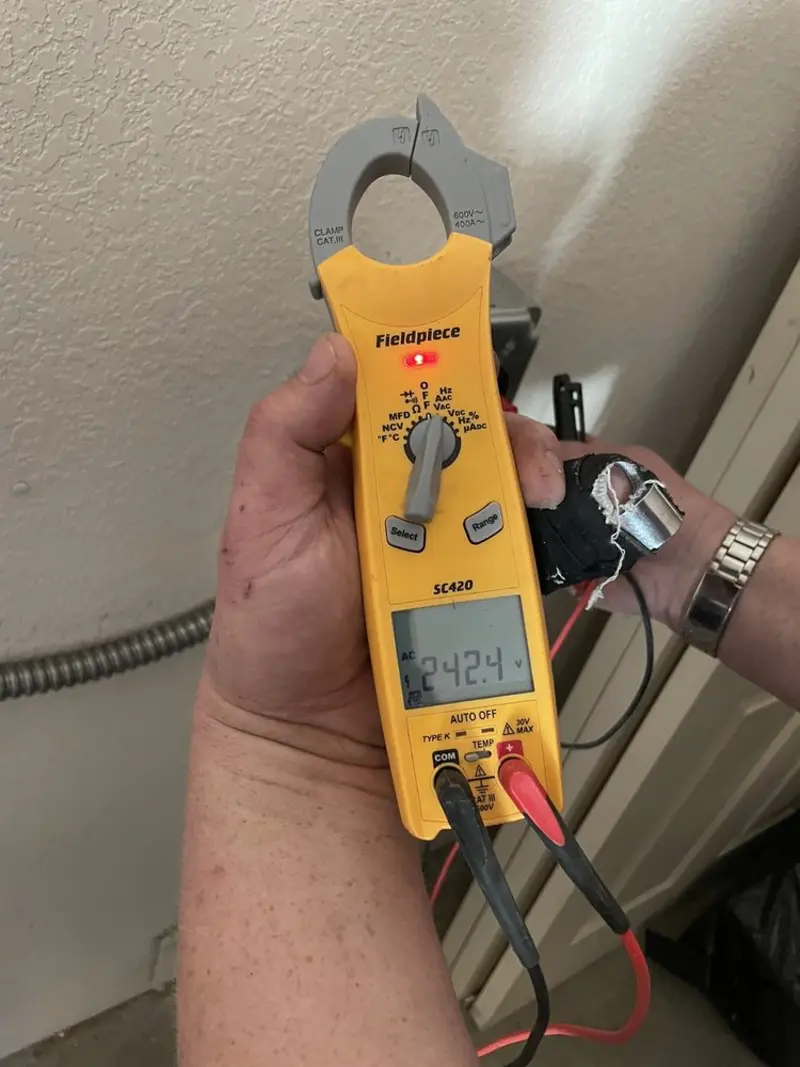 Voltage testing with clamp meter during Electrical Installation Services in Fife